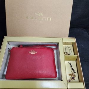 Coach wristlet with charms